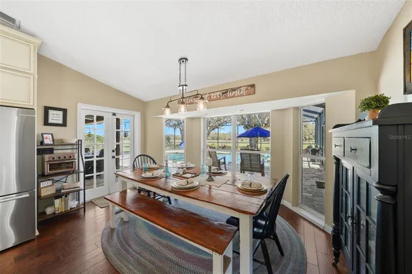 a view of a house with swimming pool and sitting area