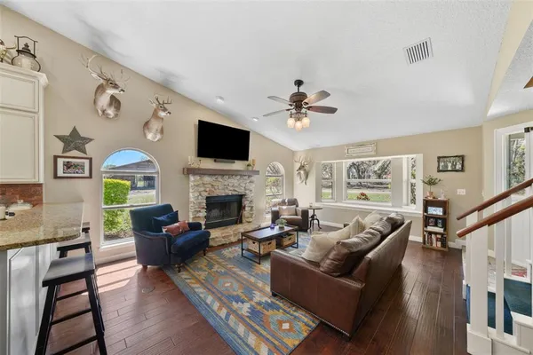 a large kitchen with stainless steel appliances granite countertop a stove and cabinets