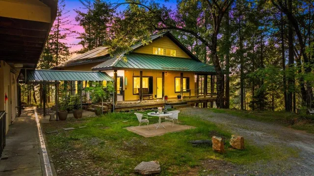 a view of an house with backyard porch and sitting area