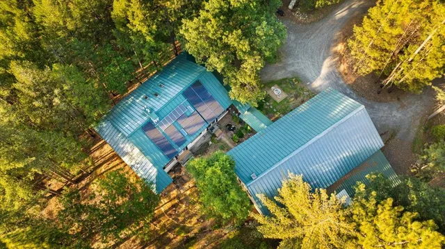 a large white kitchen with lots of counter space and stainless steel appliances