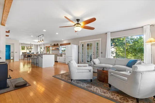 a spacious bedroom with a bed and a window