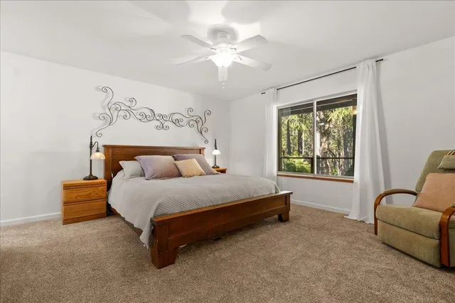 a view of patio with a table and chairs under an umbrella