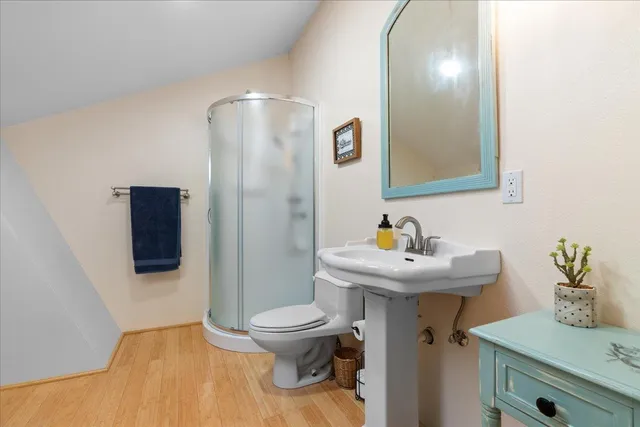 a view of a chair and table in backyard of the house