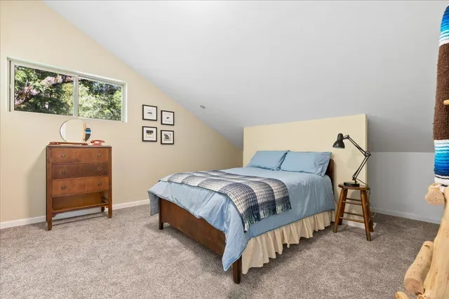 a view of a house with backyard porch and sitting area