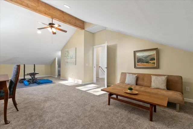 a front view of a house with a yard table and chairs