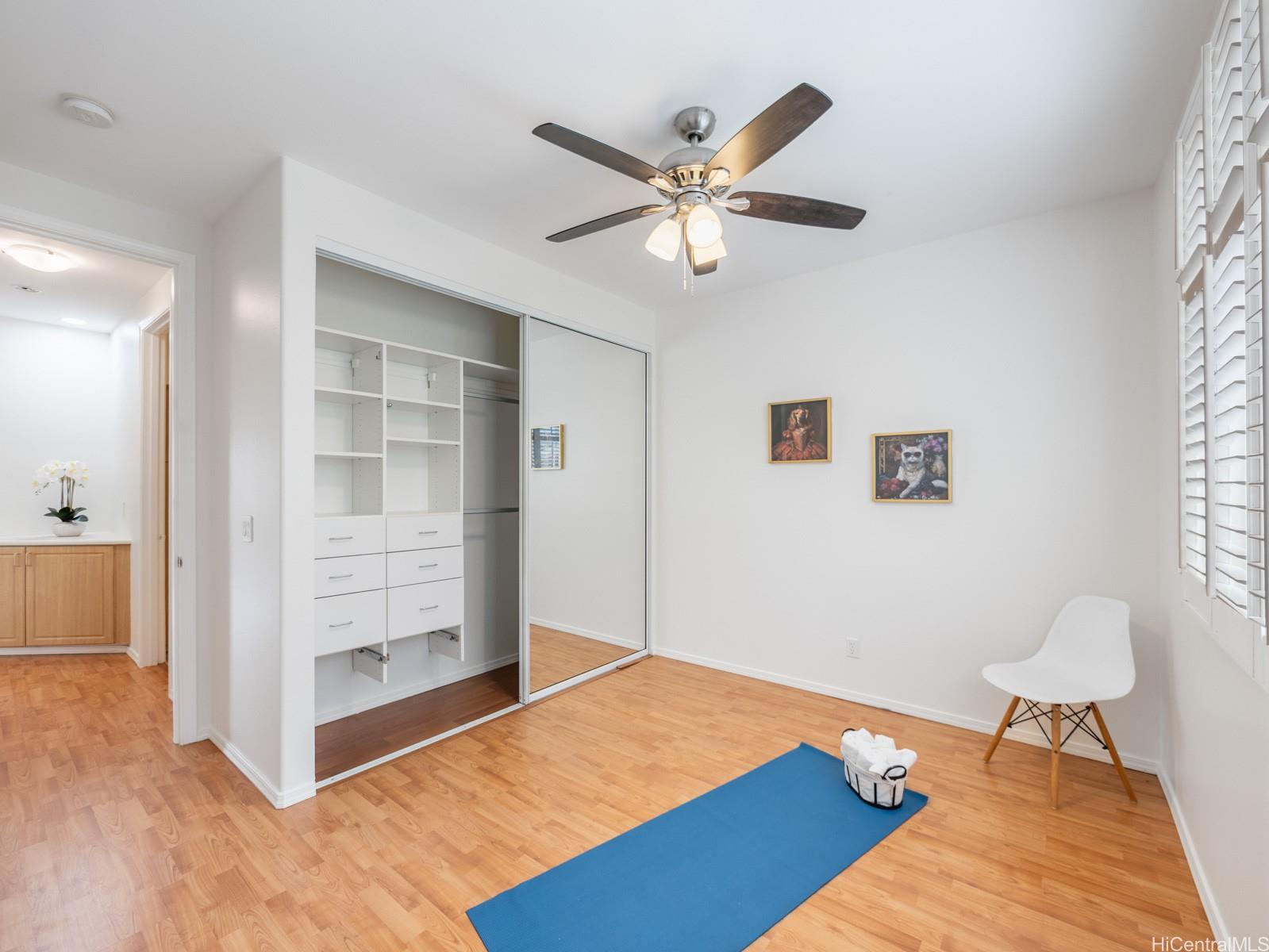 95-982 Wikao Street, Unit L203 Mililani, HI 96789 - Photo 17 of 25 a bedroom with a bed and a view of bathroom