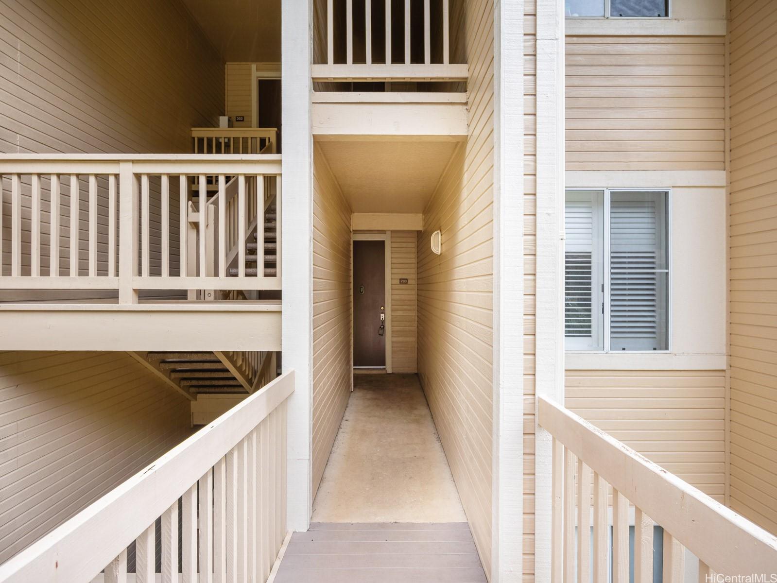 95-982 Wikao Street, Unit L203 Mililani, HI 96789 - Photo 21 of 25 a view of a balcony from a stairs