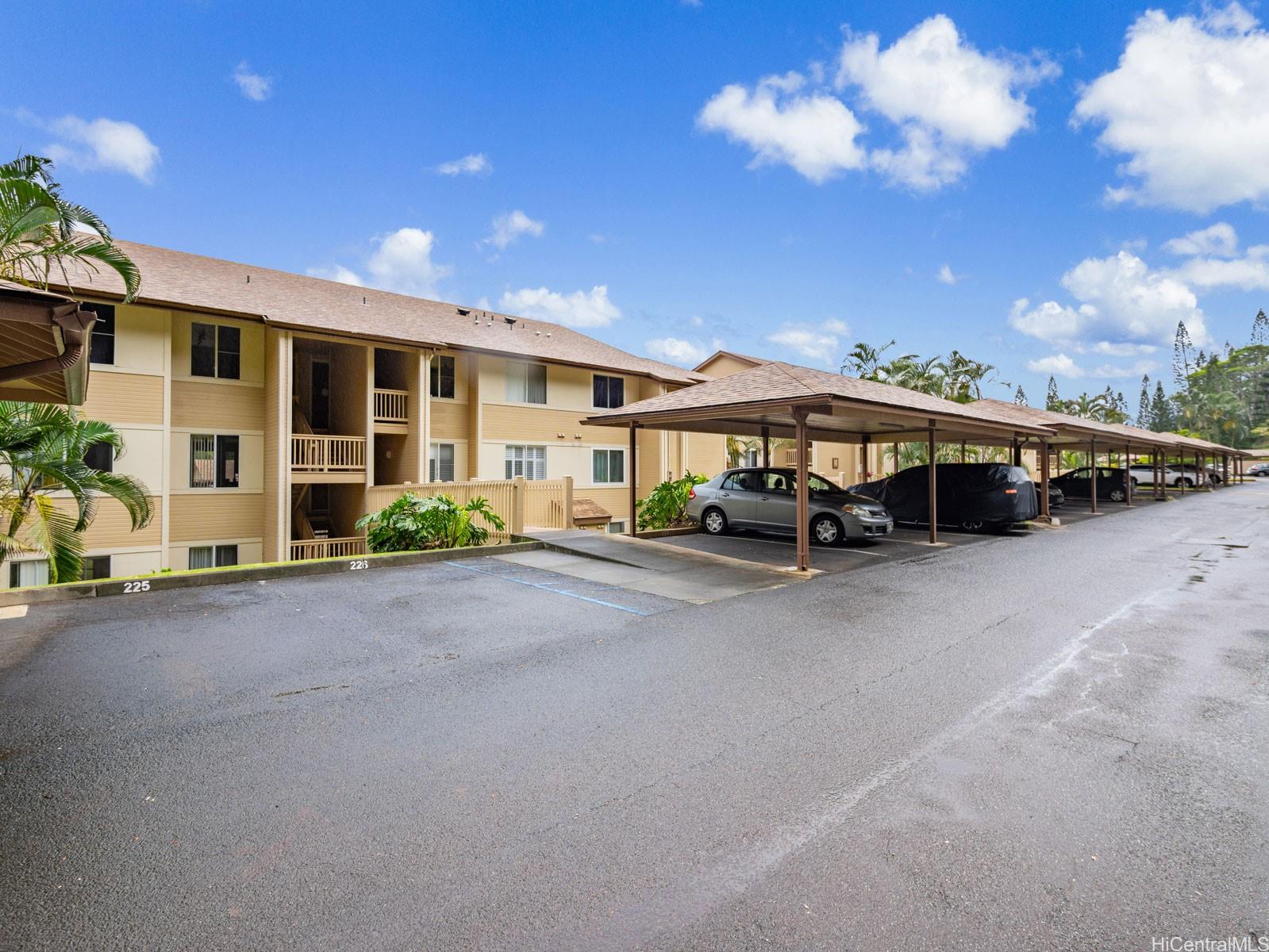 95-982 Wikao Street, Unit L203 Mililani, HI 96789 - Photo 23 of 25 a car parked in front of a house