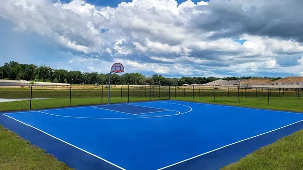 a view of an outdoor space and tennis court