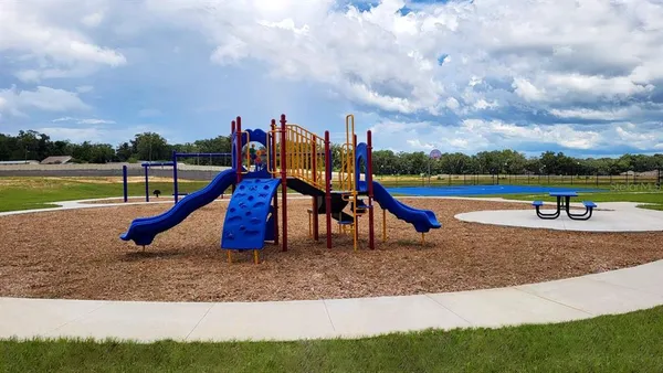 a view of a park with swings