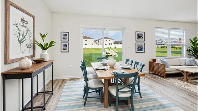 a dining room with furniture and window