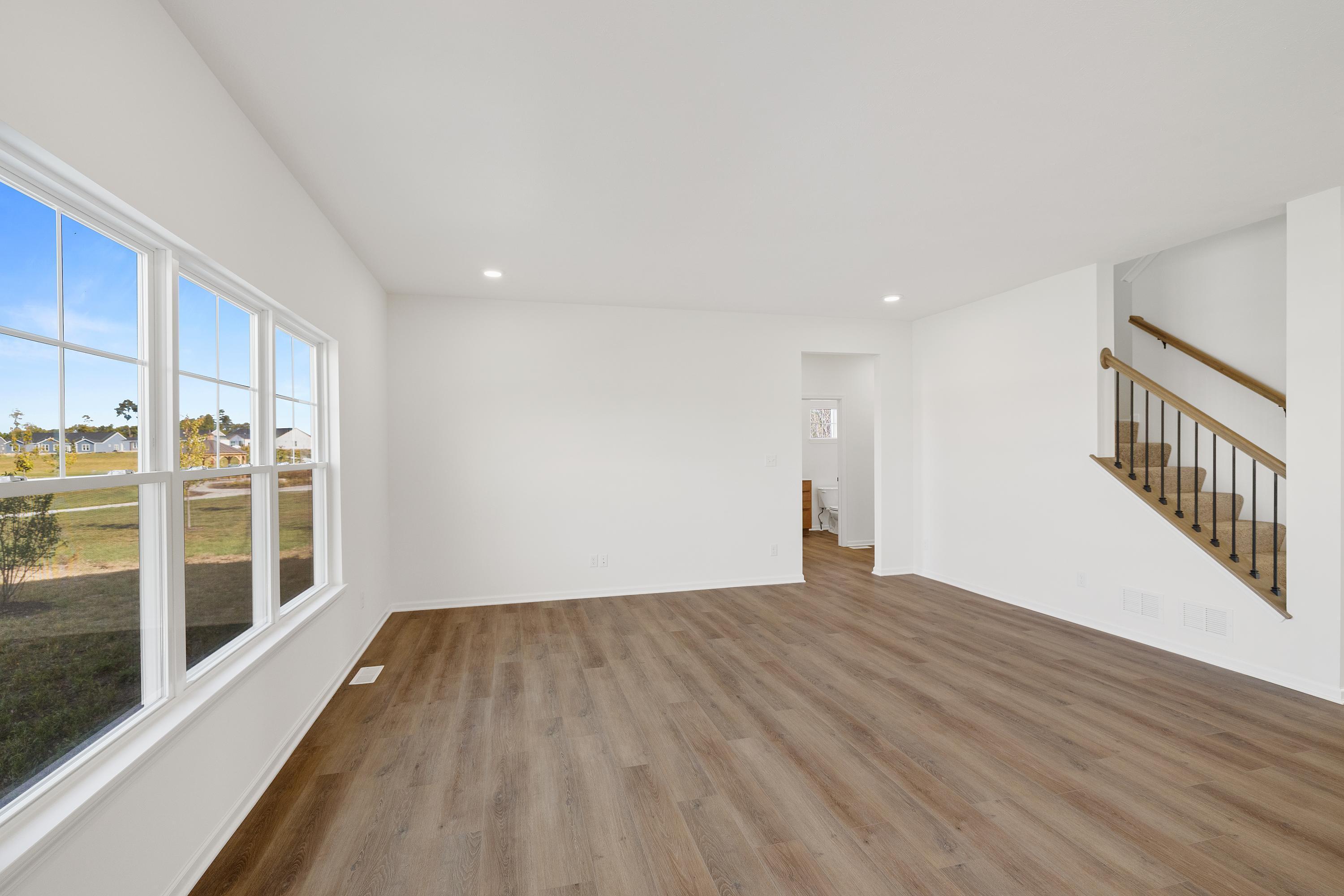 3980 Riverwood Road Valparaiso, IN 46385 - Photo 11 of 28 a view of empty room with wooden floor and windows