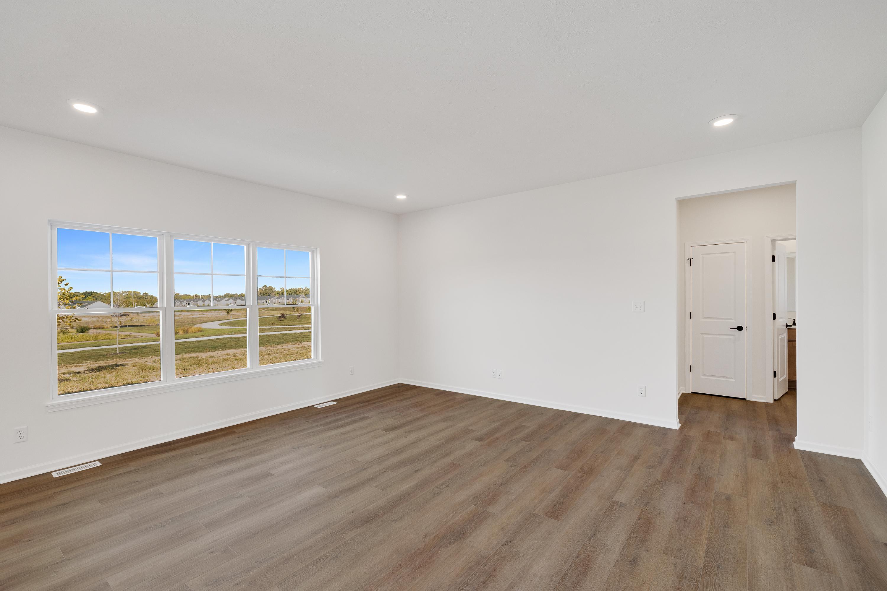 3980 Riverwood Road Valparaiso, IN 46385 - Photo 13 of 28 wooden floor in an empty room with a window