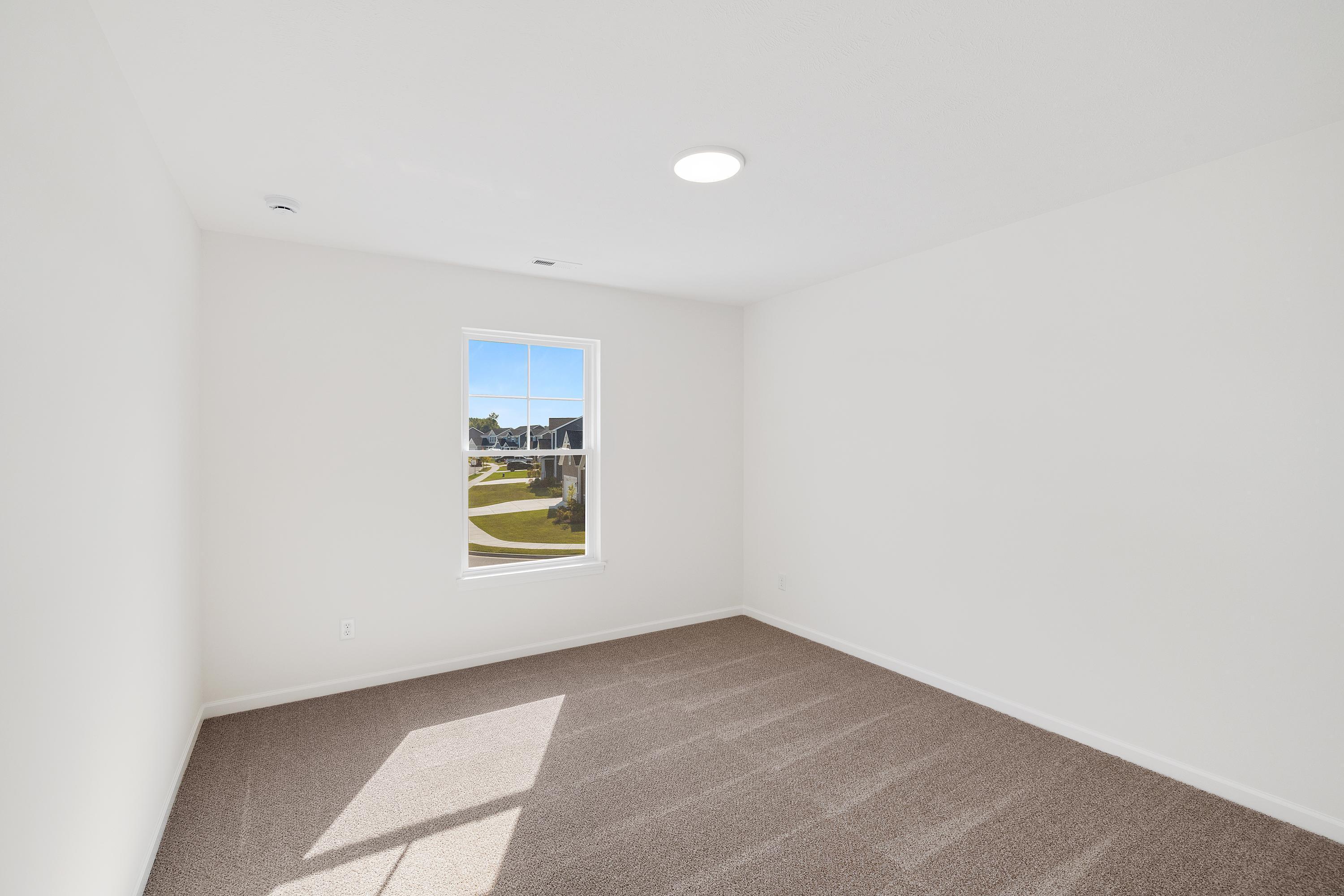 3980 Riverwood Road Valparaiso, IN 46385 - Photo 17 of 28 a view of an empty room with a window
