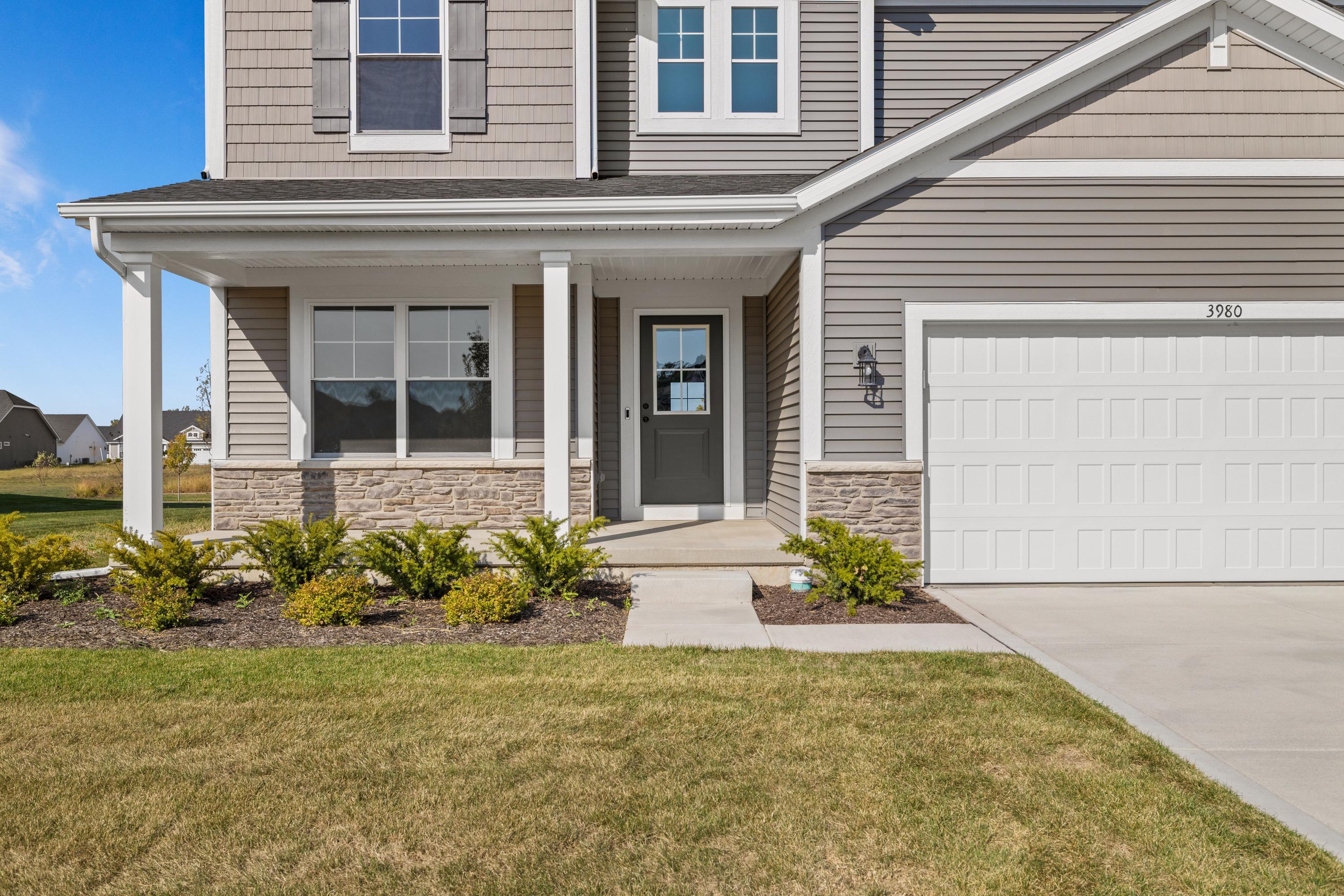 3980 Riverwood Road Valparaiso, IN 46385 - Photo 2 of 28 a front view of a house with a yard
