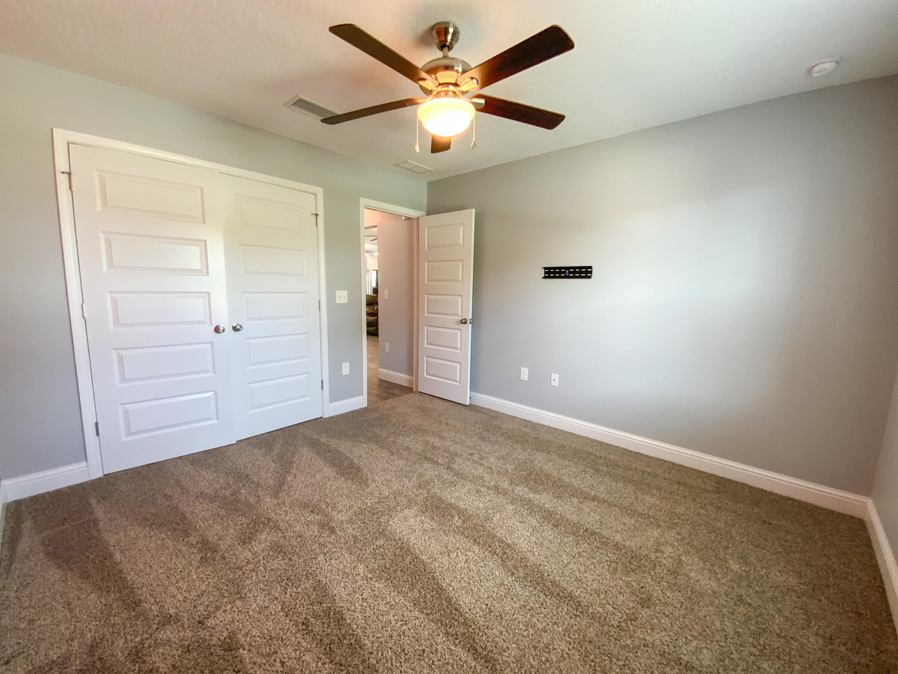 2896 Chancery Lane Crestview, FL 32539 - Photo 22 of 33 an empty room with closet and fan