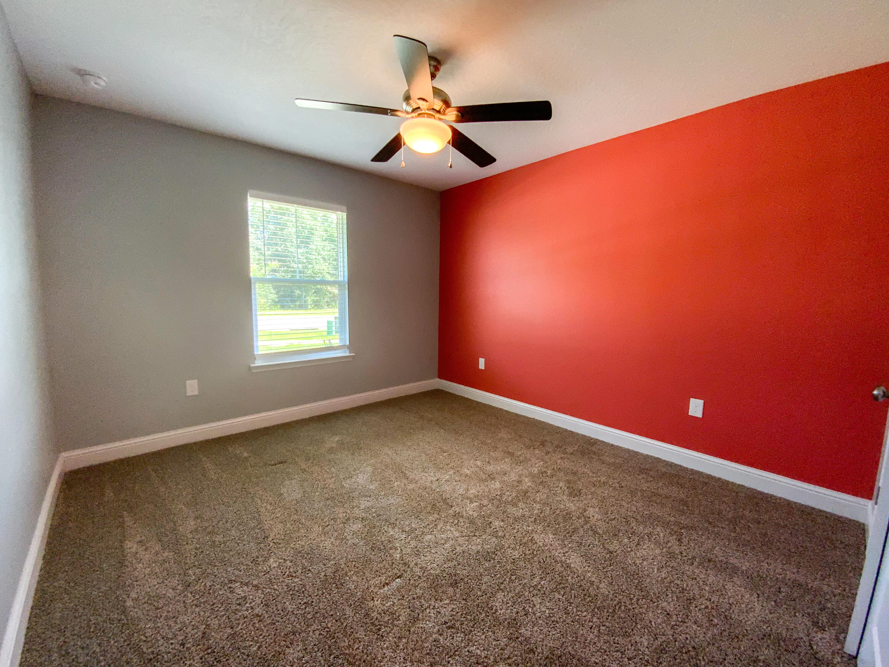2896 Chancery Lane Crestview, FL 32539 - Photo 23 of 33 an empty room with a ceiling fan and window
