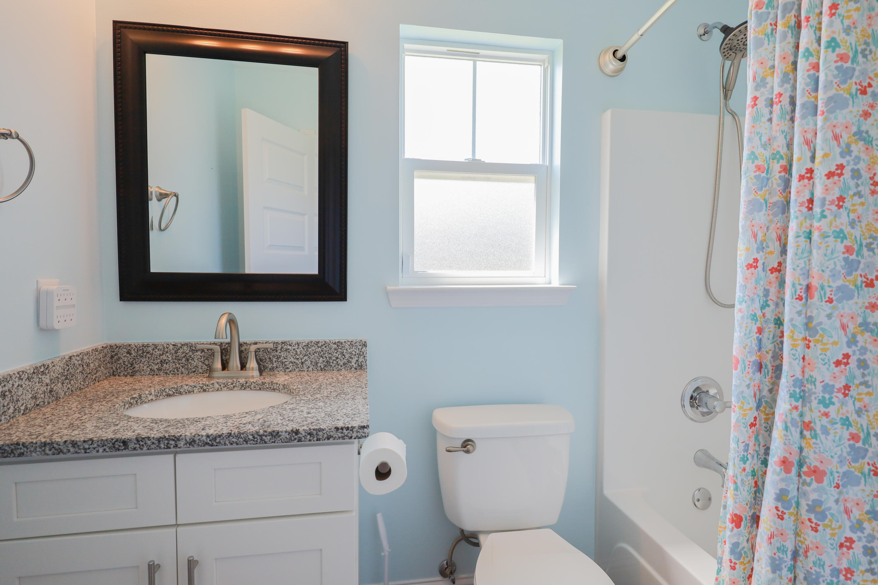 2896 Chancery Lane Crestview, FL 32539 - Photo 24 of 33 a bathroom with a granite countertop sink a toilet and a mirror