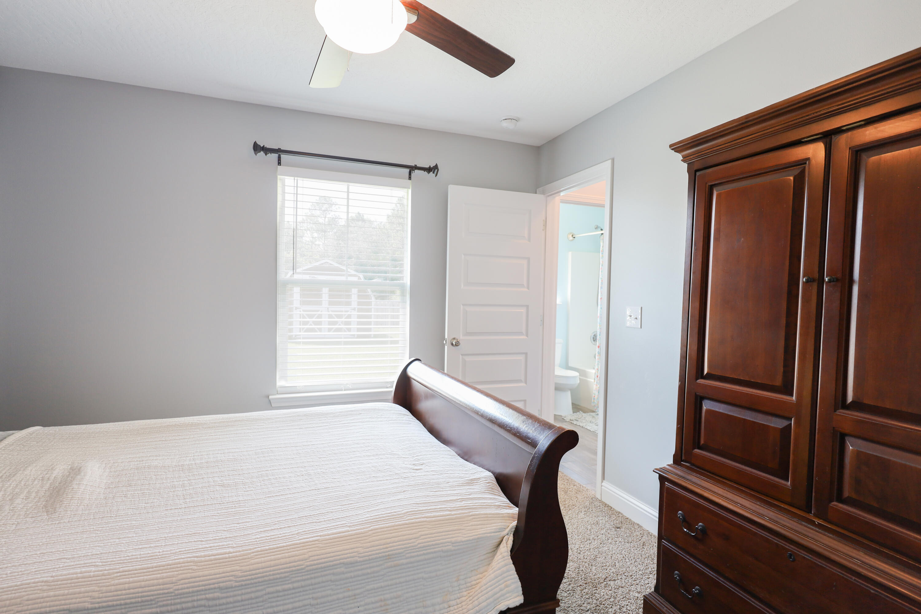 2896 Chancery Lane Crestview, FL 32539 - Photo 26 of 33 a bedroom with a bed and a window