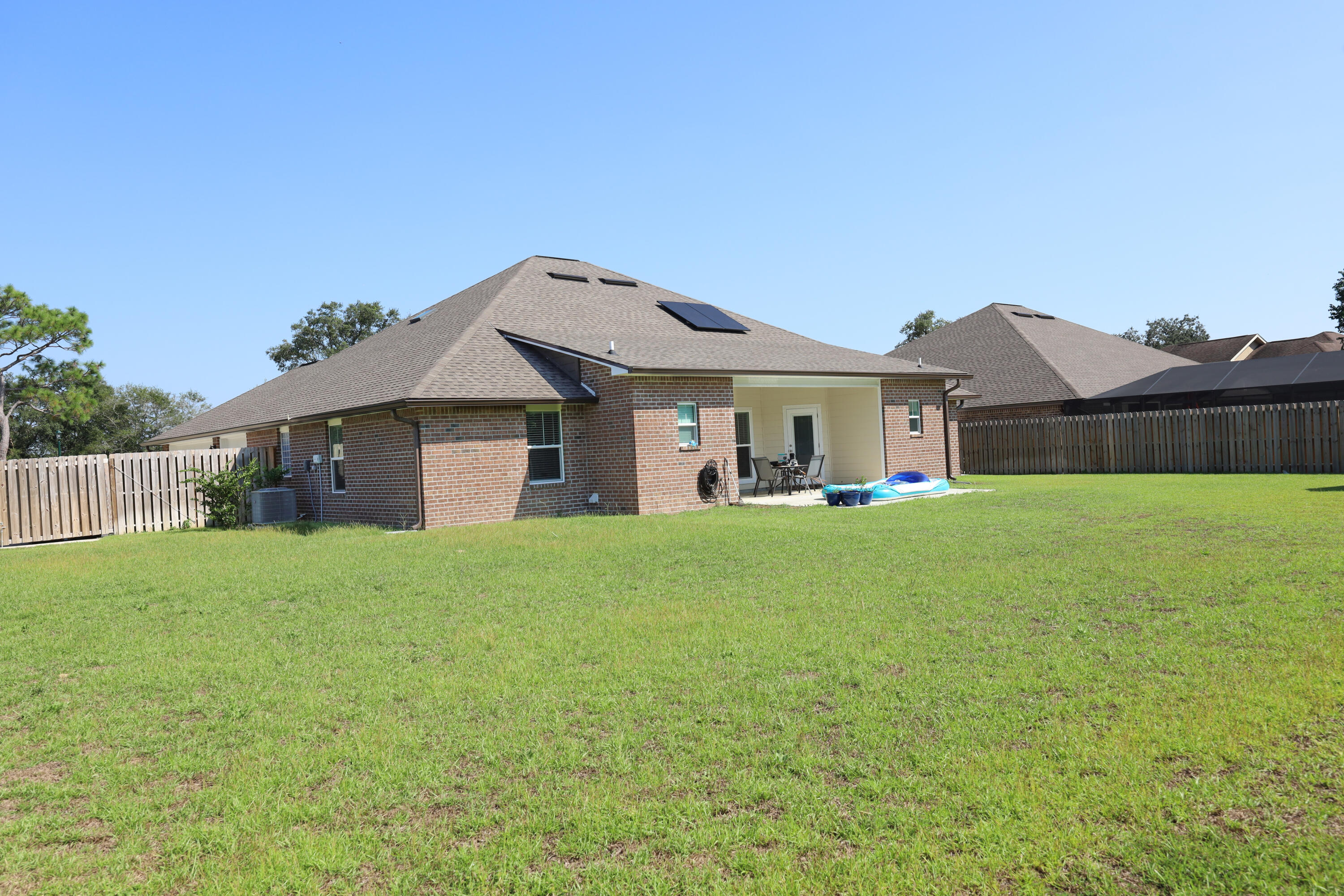 2896 Chancery Lane Crestview, FL 32539 - Photo 30 of 33 a view of a house with a back yard