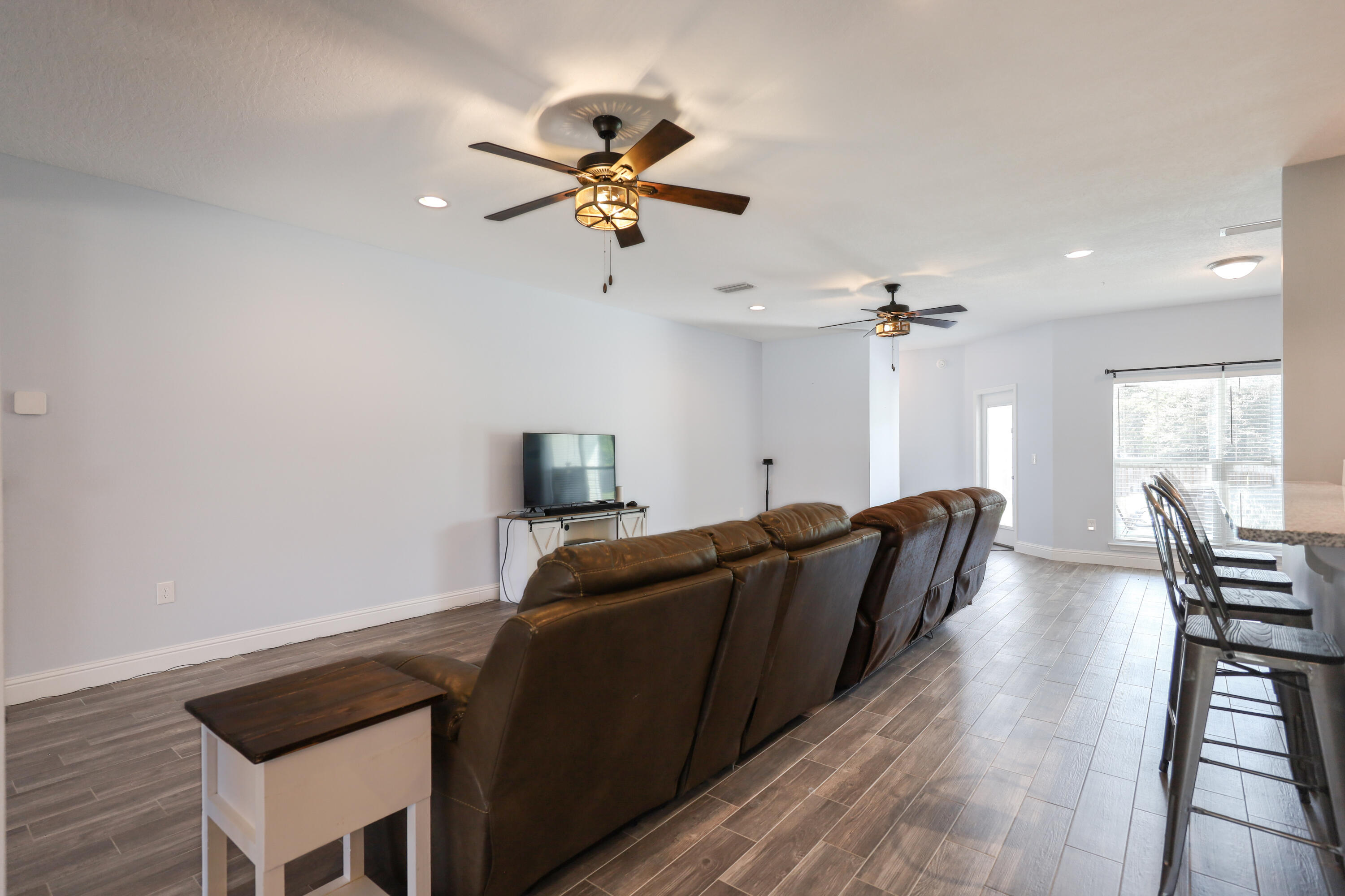 2896 Chancery Lane Crestview, FL 32539 - Photo 5 of 33 a living room with furniture and a wooden floor