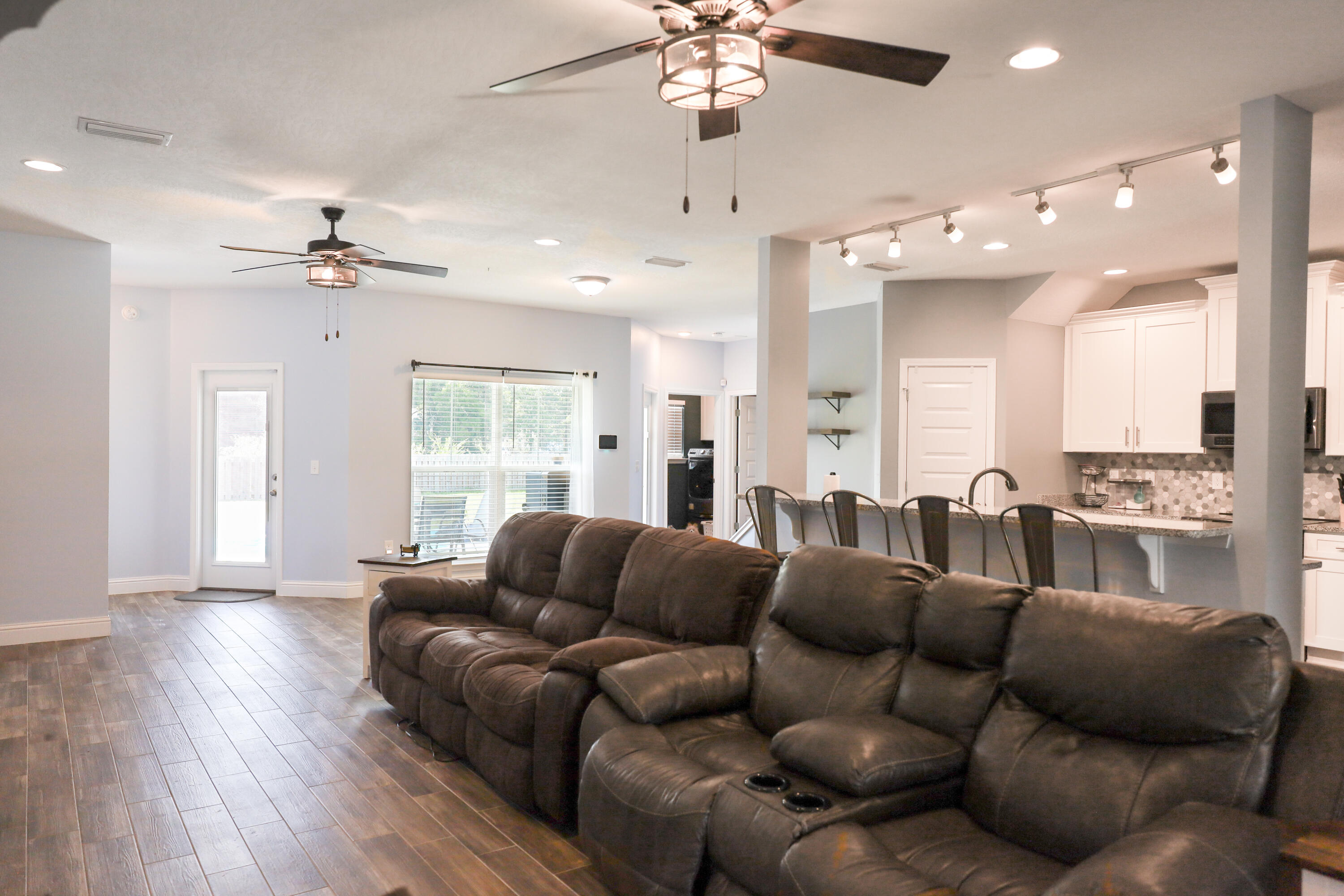 2896 Chancery Lane Crestview, FL 32539 - Photo 6 of 33 a living room with furniture and a large window