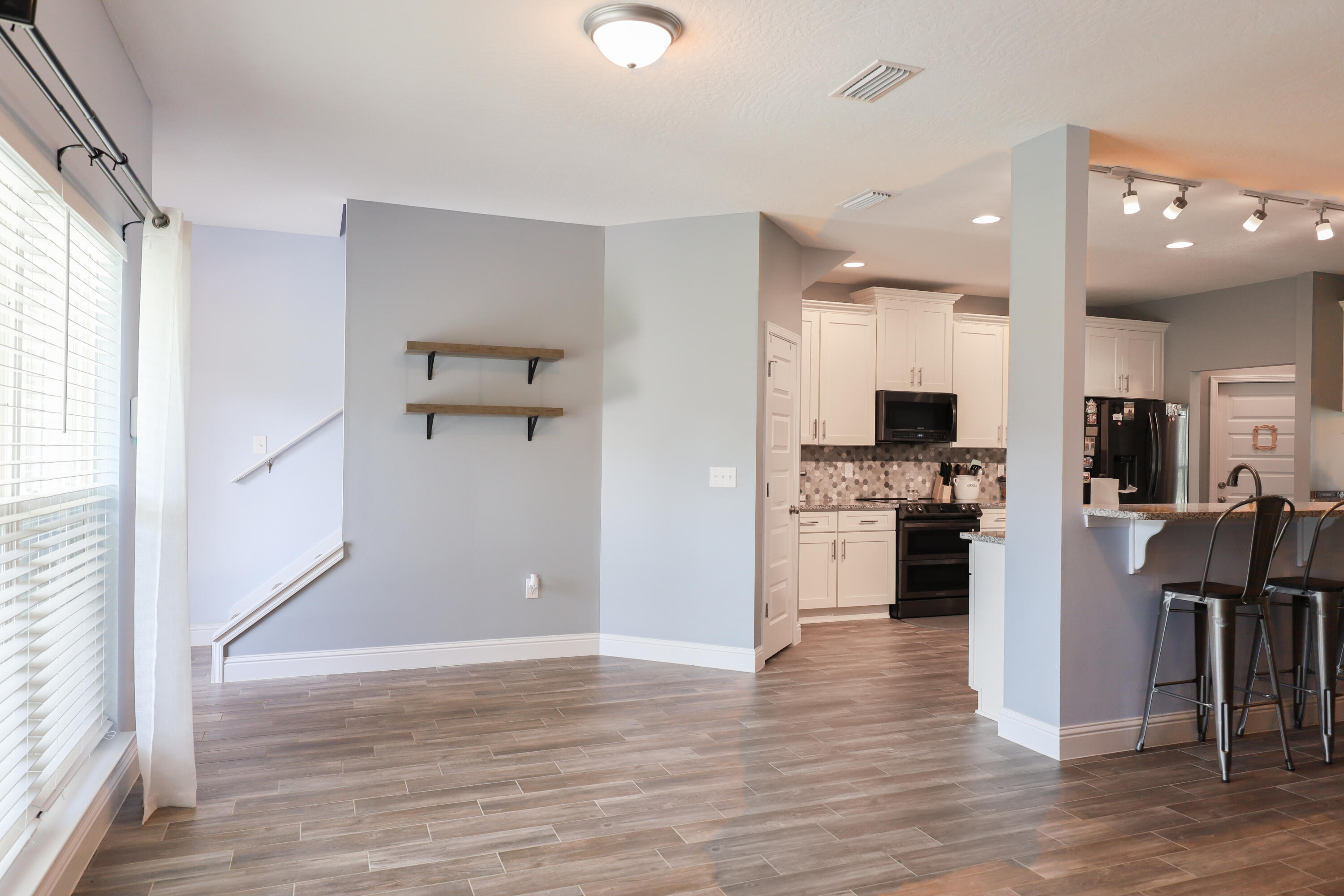 2896 Chancery Lane Crestview, FL 32539 - Photo 10 of 33 a view of kitchen with refrigerator microwave and stove