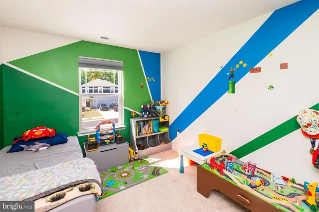 a living room with a baby crib