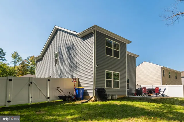 a view of house with outdoor seating