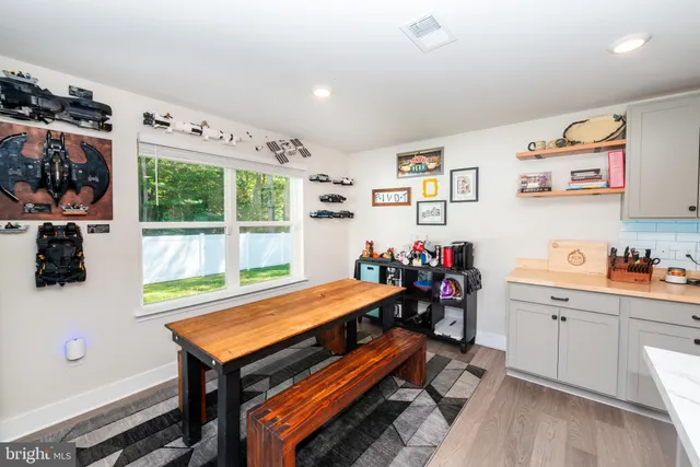 a room with furniture and a flat screen tv