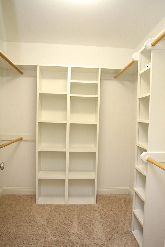 508 Mial Street Raleigh, NC 27608 - Photo 18 of 25 One of the 2 master closets with custom designed shelving layout. Master Closet