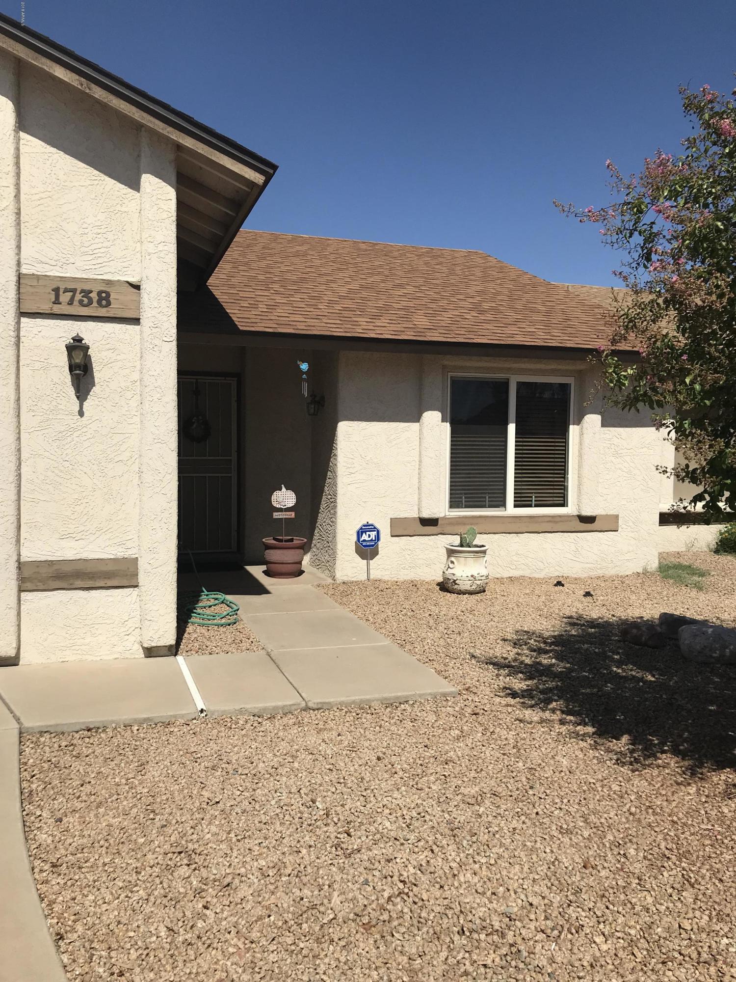 1738 East Grandview Road Phoenix, AZ 85022 - Photo 1 of 15 a view of a house with snow on the road