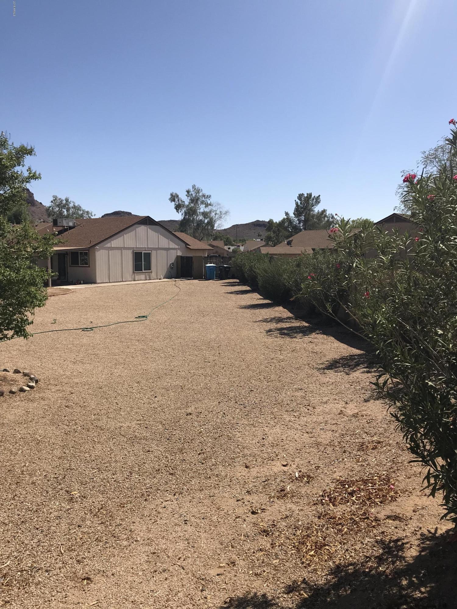 1738 East Grandview Road Phoenix, AZ 85022 - Photo 13 of 15 a front view of a house with a yard