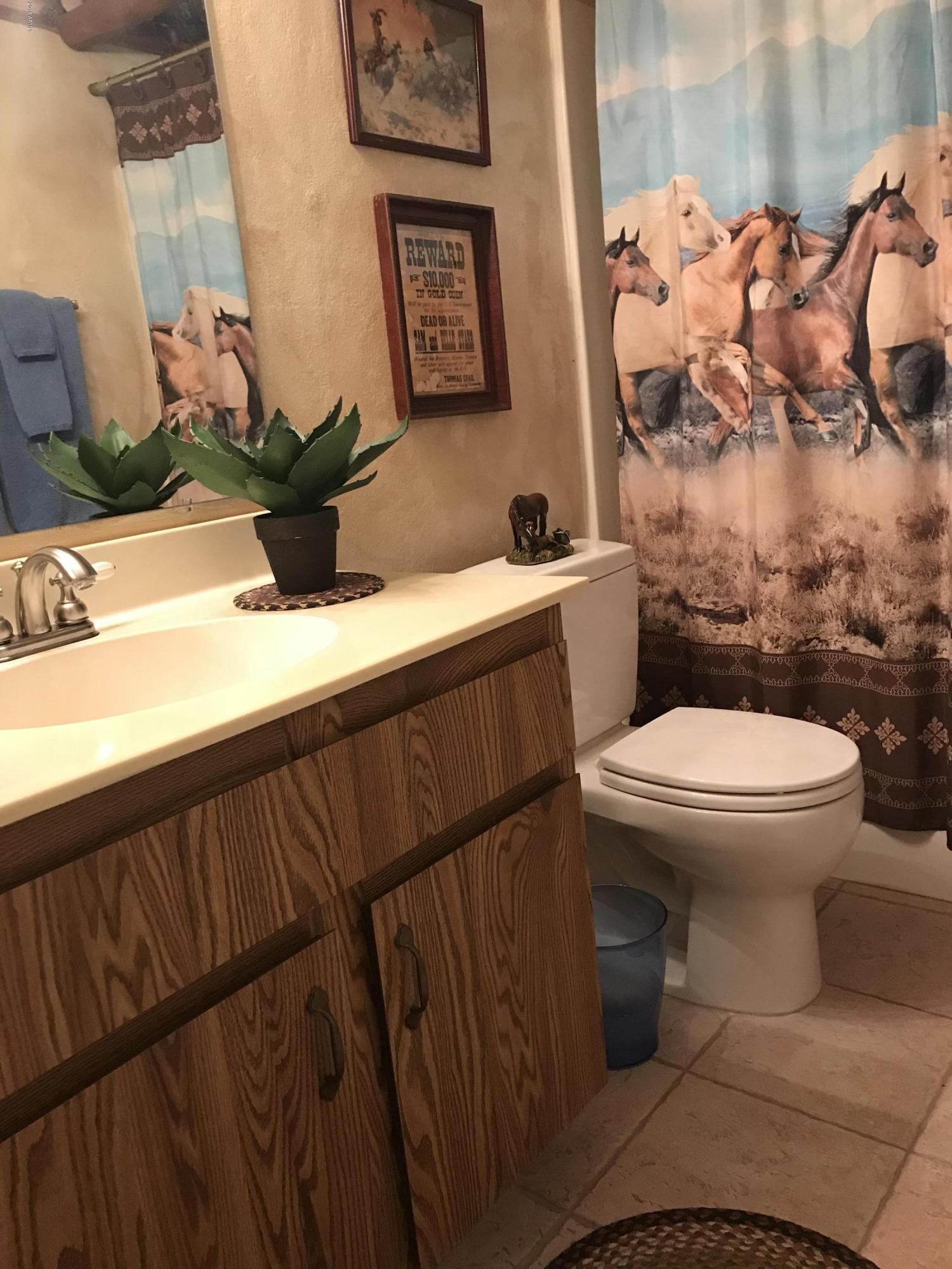 1738 East Grandview Road Phoenix, AZ 85022 - Photo 8 of 15 a bathroom with a toilet and a sink