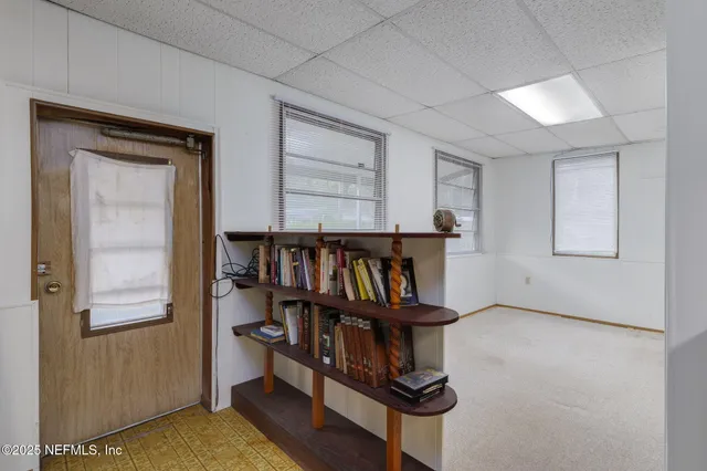 a view of a hallway with windows