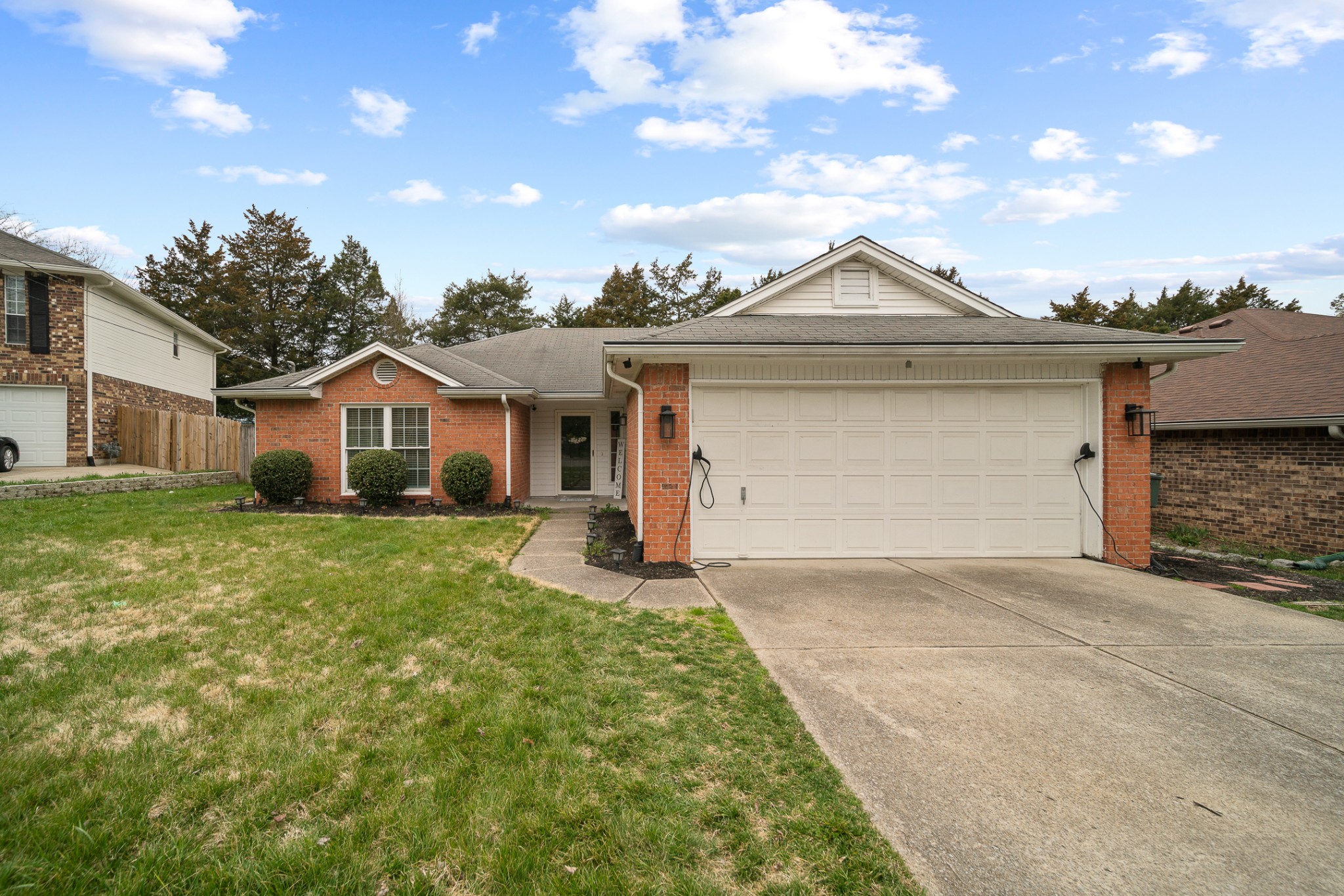 1233 Jacksons View Road Hermitage, TN 37076 - Photo 1 of 21 a front view of a house with a yard and garage