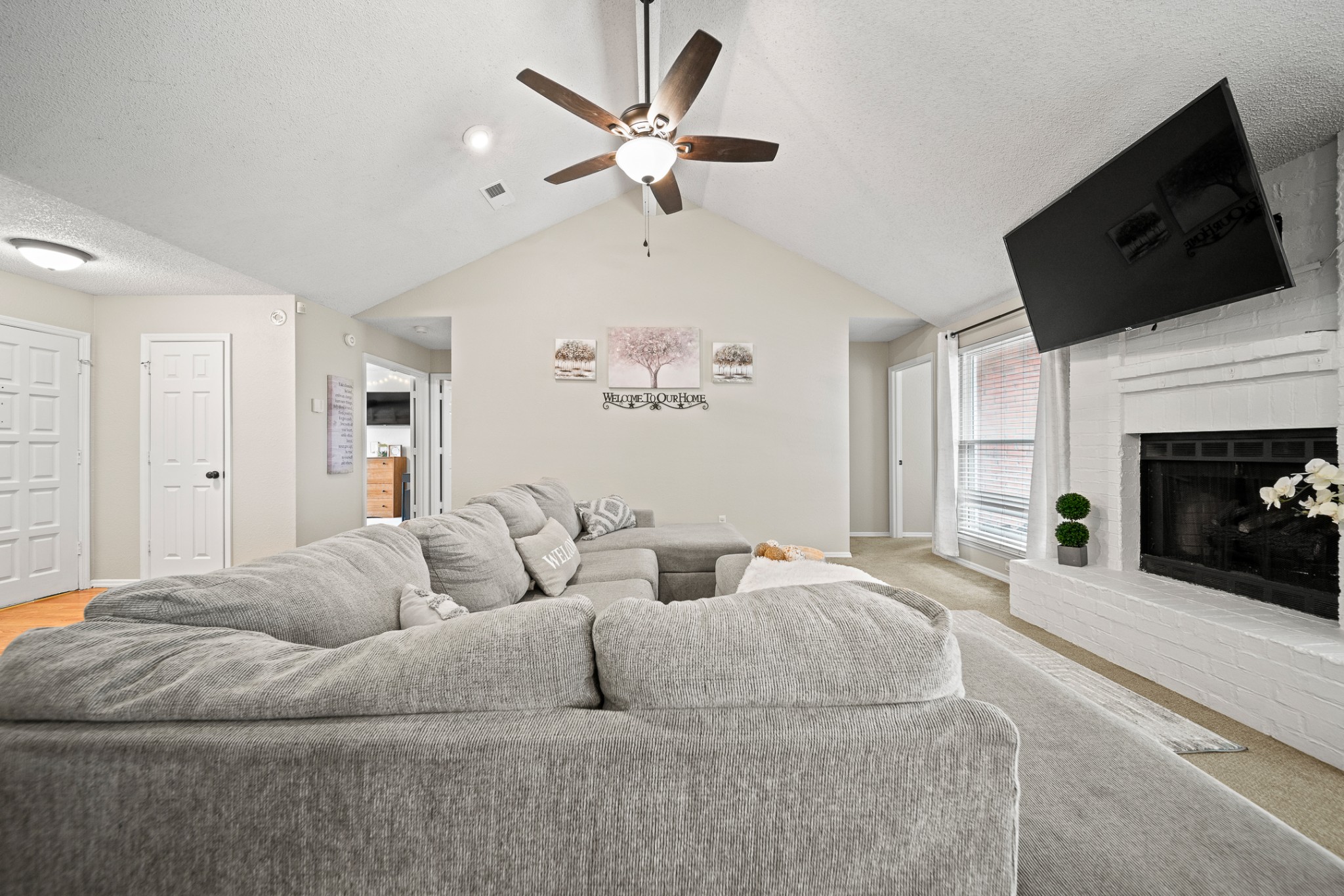 1233 Jacksons View Road Hermitage, TN 37076 - Photo 6 of 21 a living room with furniture a fireplace and a flat screen tv