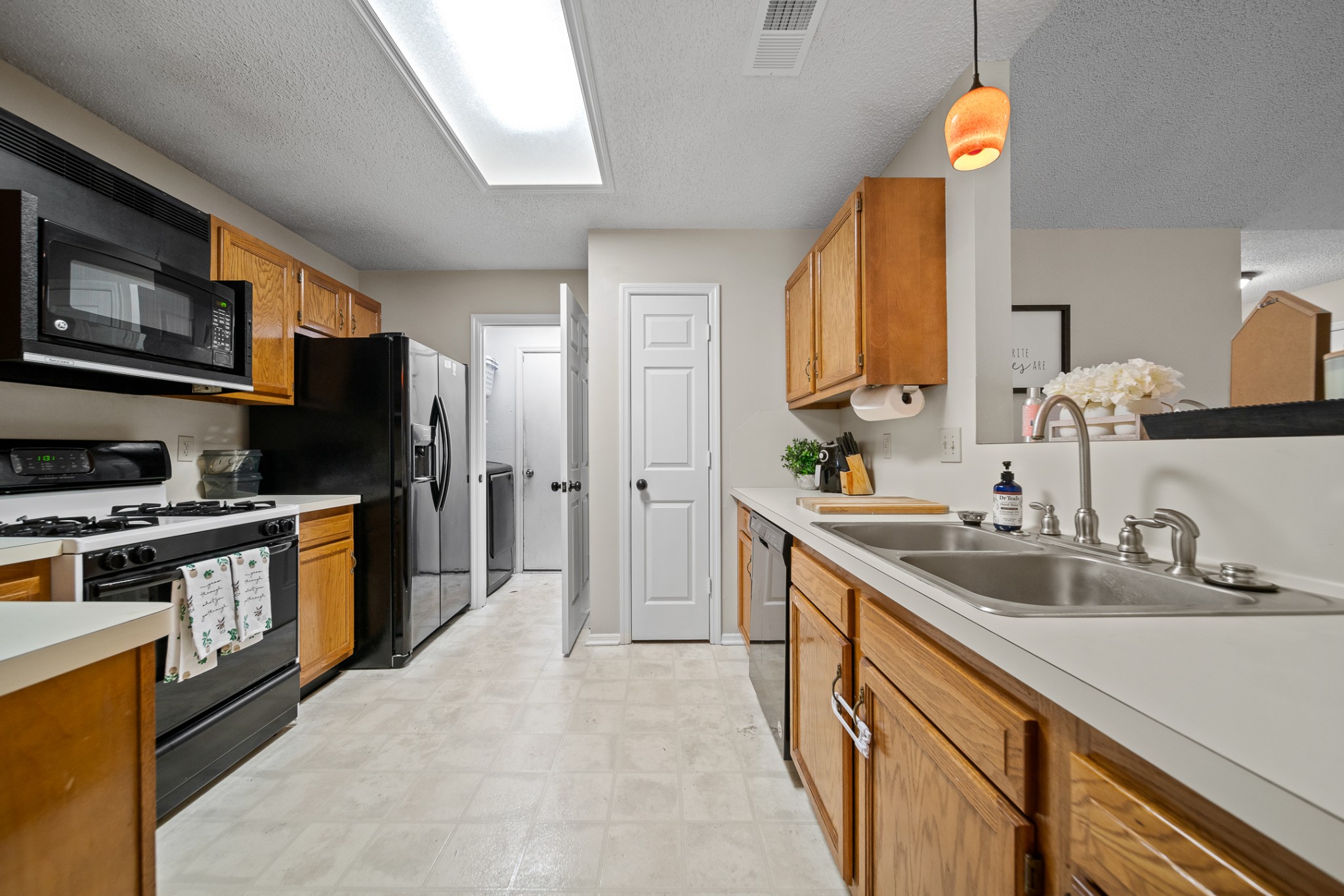 1233 Jacksons View Road Hermitage, TN 37076 - Photo 9 of 21 a kitchen with stainless steel appliances a sink stove and refrigerator