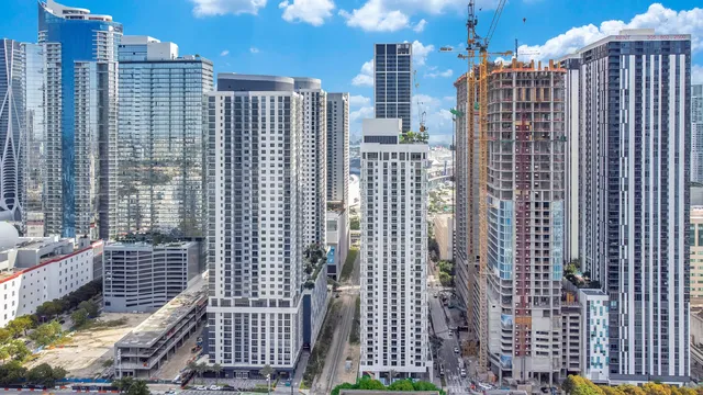 a view of a city with tall buildings