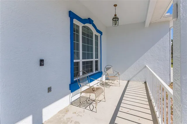 an aerial view of beach and residential houses with outdoor space