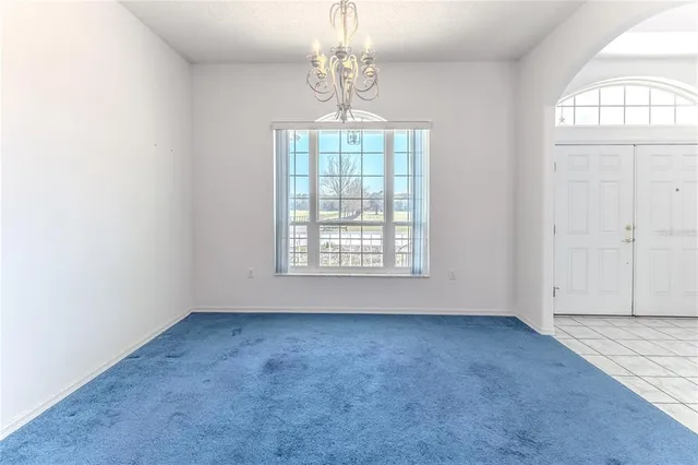 a view of empty room with a fireplace