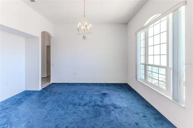 a living room with a fireplace and a fireplace