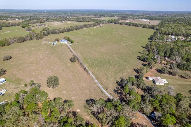 a kitchen with stainless steel appliances granite countertop a stove top oven a sink a counter top space and cabinets