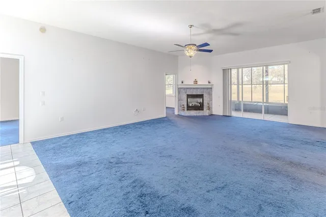 an aerial view of a houses with a yard