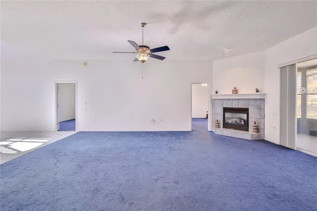 a view of a dining room with furniture large windows and wooden floor