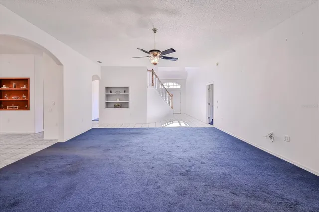 a bedroom with a large bed and a couch