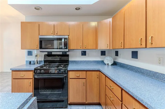 a bedroom with a large bed and a couch