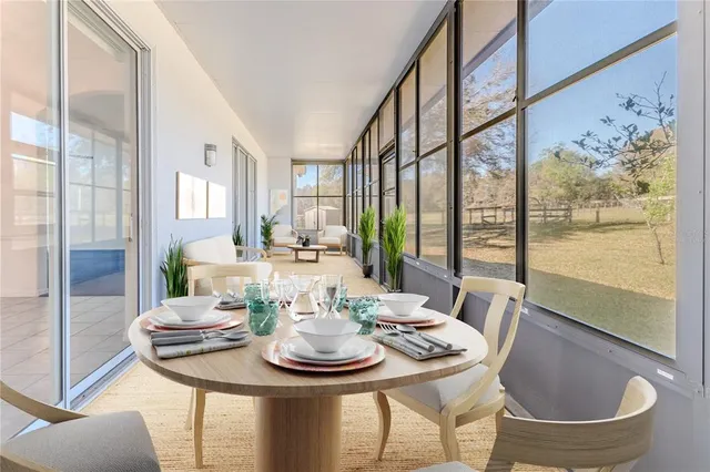 a room with pool table and windows