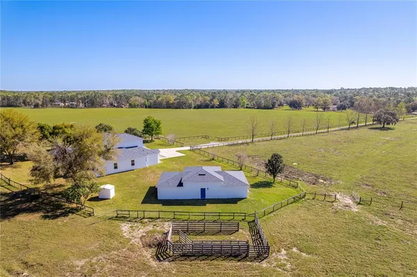 a room with pool tables and window