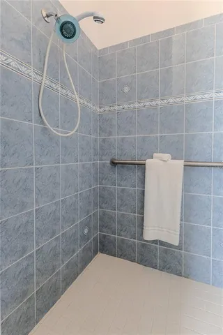 an aerial view of a houses with a lake view